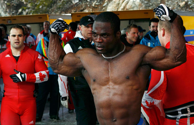 Lascelles Brown of team Canada 1 celebrates at the finish of heat 4 of the four-man bobsleigh competition at the Vancouver 2010 Winter Olympics in Whistler